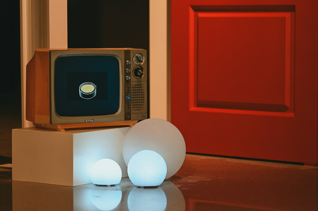 Retro television screen glowing with static in a dim room
